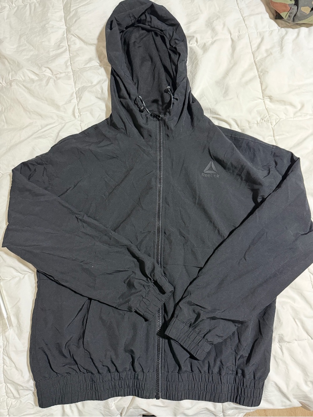 Reebok woman’s Black Hooded Windbreaker Jacket